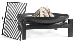 Black metal fire pit with logs on a white background