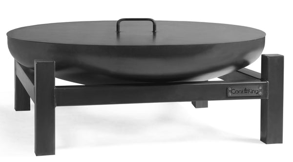 Black fire pit with lid on a white background