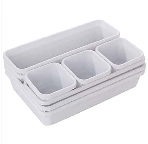 Eight modular storage trays in different sizes