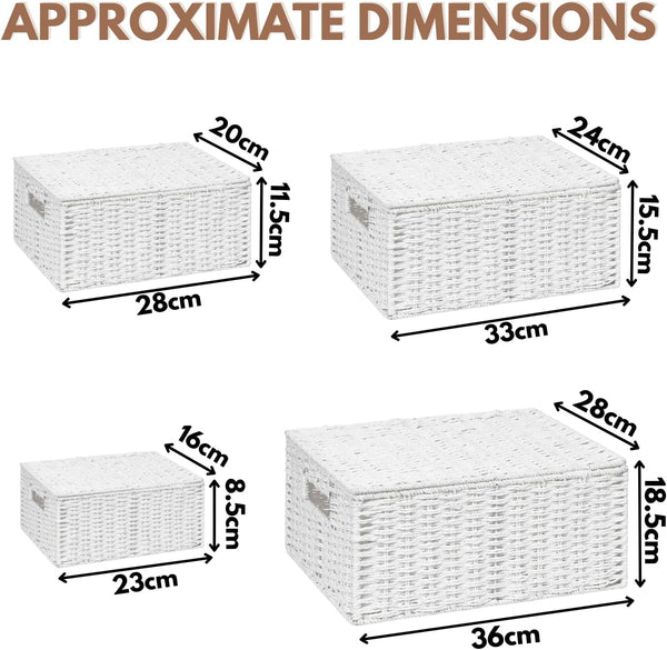 Four white wicker baskets in different sizes