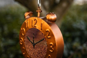 Wild bird feeding station with vintage clock style