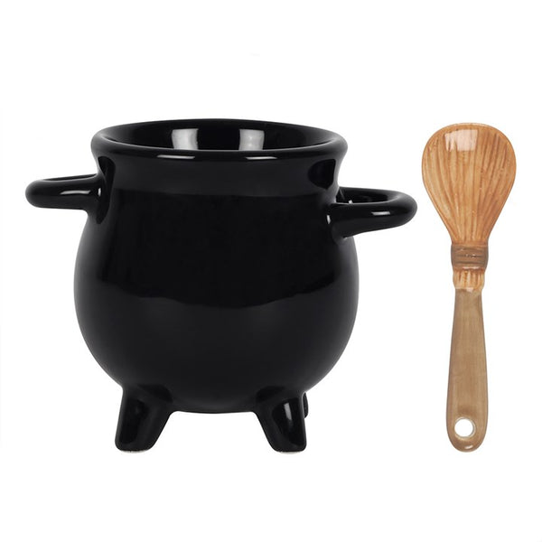 Black cauldron-shaped pot with wooden spoon on a white background