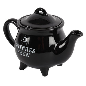 Gothic black teapot displayed with tea cups