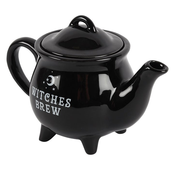 Gothic black teapot displayed with tea cups