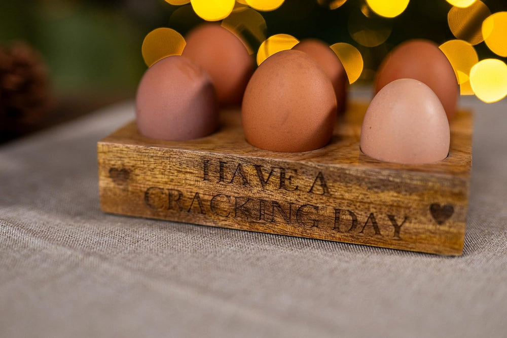 Wooden egg holder with Have a Cracking Day design.