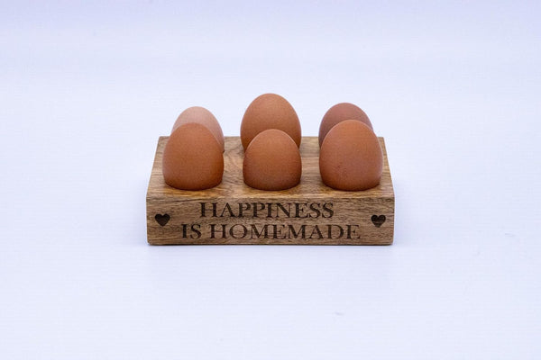 Wooden egg rack for kitchen worktop storage.