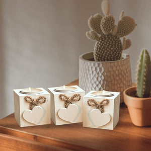 Wooden heart tea light holders arranged on a table