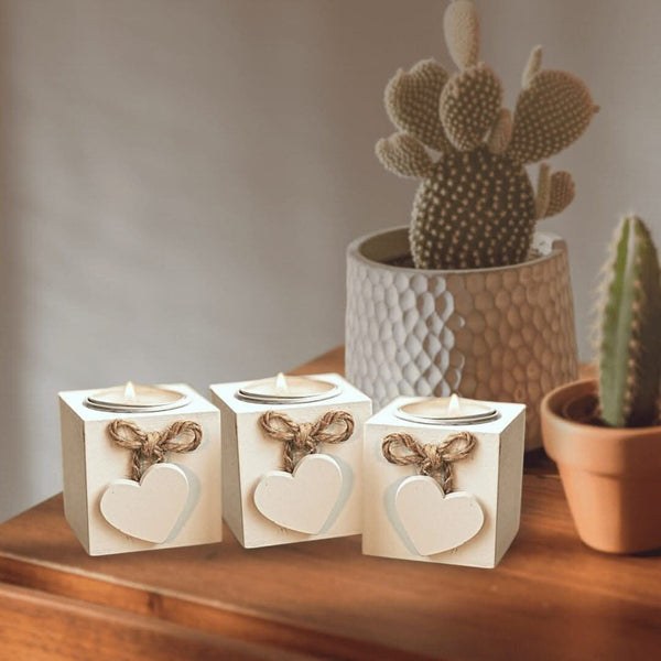 Wooden heart tea light holders arranged on a table