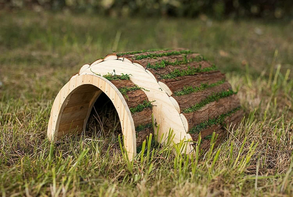 Wooden hedgehog house with grass effect roof
