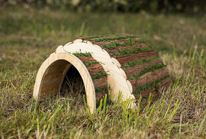 Wooden hedgehog house with grass effect roof