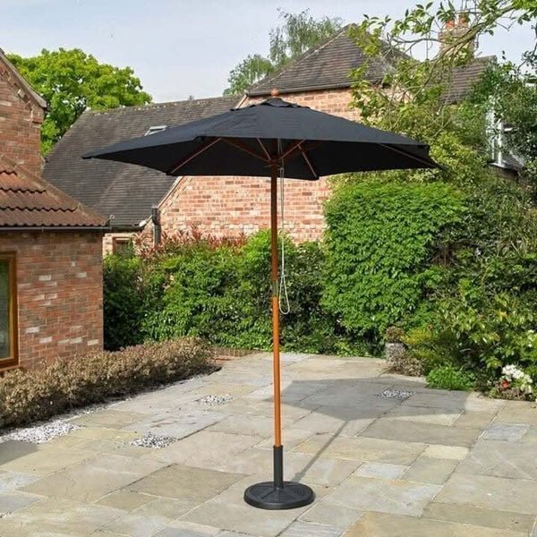 Black patio parasol shown with outdoor furniture