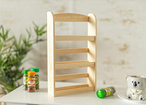 Three tier wooden spice rack on kitchen counter