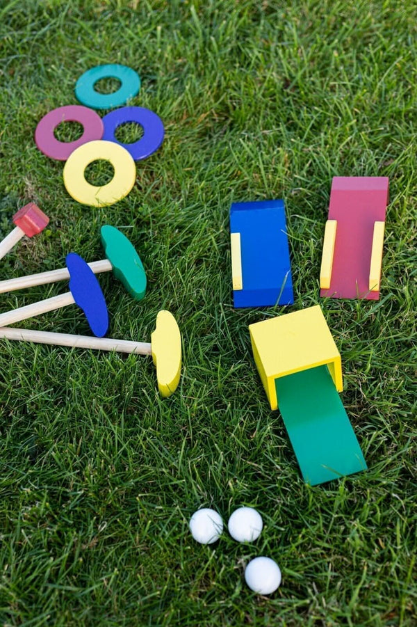Children's golf playset with clubs ramps and balls