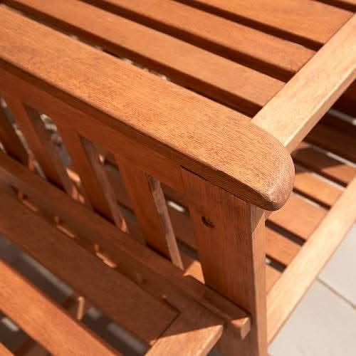 Natural wood companion chair shown from the front