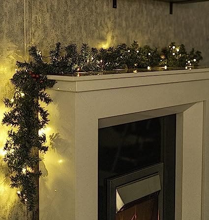 christmas-garland-with-lights-pine-cone-and-berries